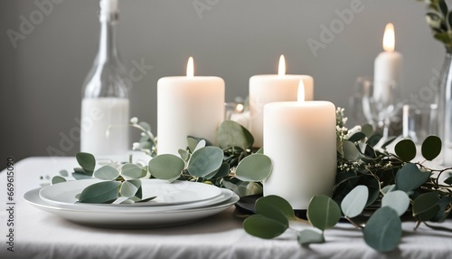 Minimalist tablescape design: White and green with eucalyptus and candles