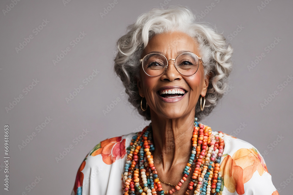 Happy elderly black woman wearing colorful red outfit, classic glasses, laughing in photo studio Happy elderly black woman wearing colorful red outfit, classic glasses, laughing in photo studio