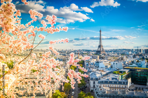 famous Eiffel Tower and Paris roofs at spring, Paris France © neirfy