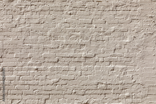 pattern of old historic brick wall painted in ochre mixed with grey