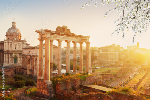 Forum - Roman ruins with cityscape of Rome with sunrise light at spring day, Italy
