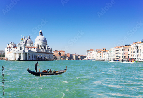 Basilica Santa Maria della Salute and Grand canal with gondola boat, Venice, Italy © neirfy