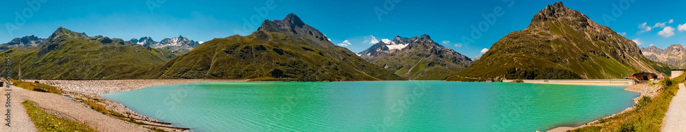 High resolution stitched alpine summer panorama with reflections in a lake at Sylvretta reservoir, Sylvretta-High-Alps-Street, Bielerhoehe, Vorarlberg, Tyrol, Austria