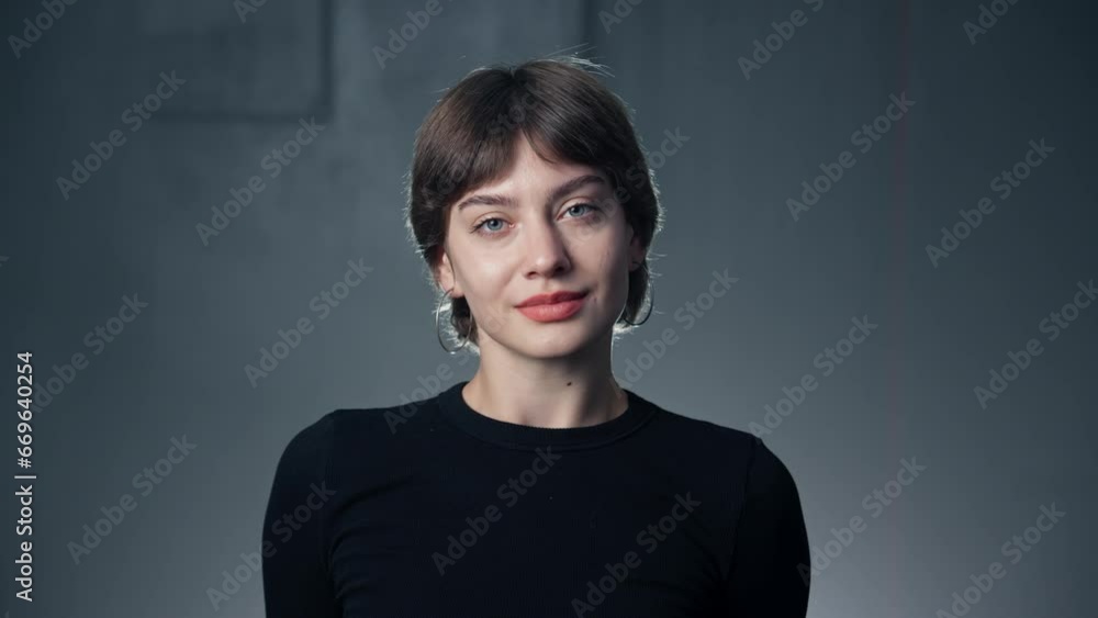 Portrait of cute woman in dark studio with smoke and lighting. Artist performance. Sensual female dancer. 4K, UHD Portrait of cute woman in dark studio with smoke and lighting. Artist performance. Sensual female dancer. 4K, UHD