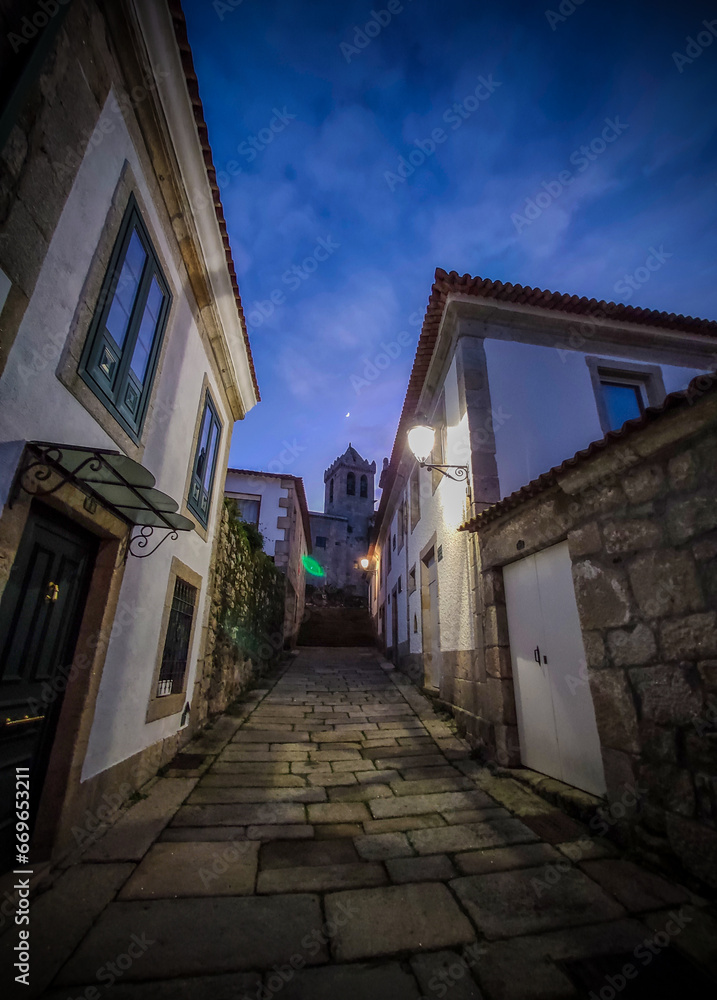 Medieval streets, from centuries ago, with beautiful and well-kept buildings, at dusk