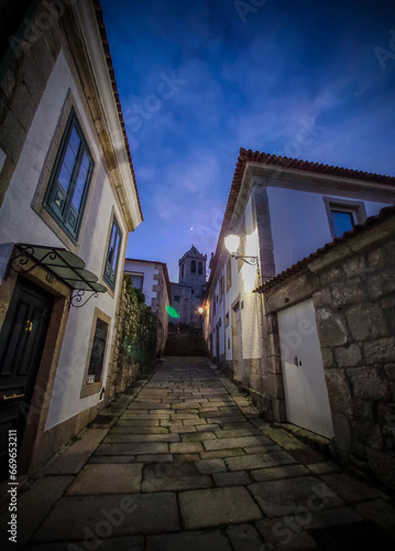 Medieval streets  from centuries ago  with beautiful and well-kept buildings  at dusk