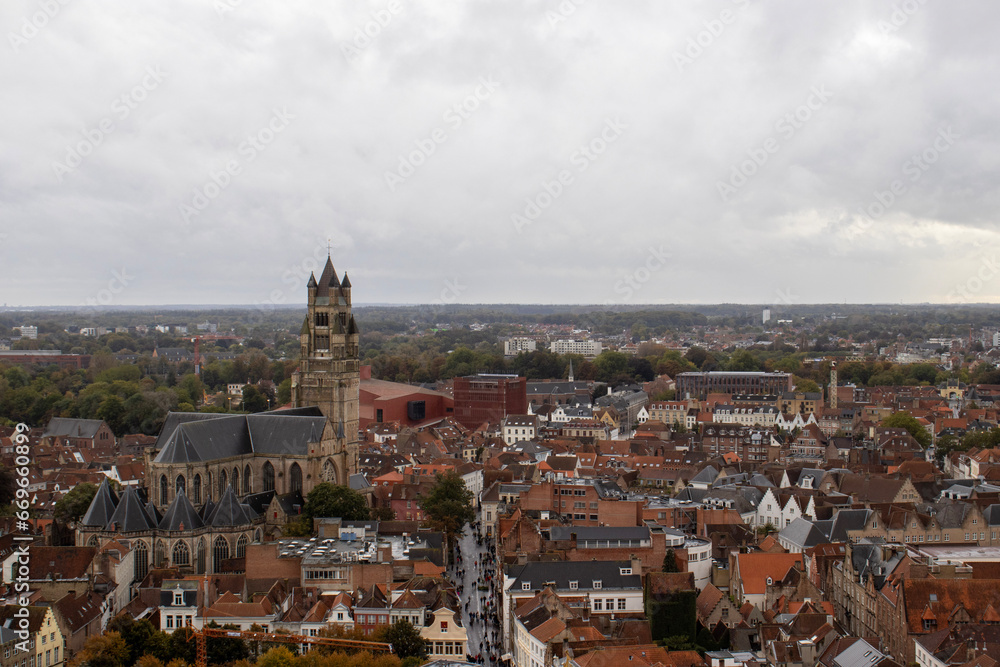 Breathtaking panoramic view from the Belfry of Bruges, capturing the city's red-roofed houses and the iconic Sint-Salvatorskathedraal