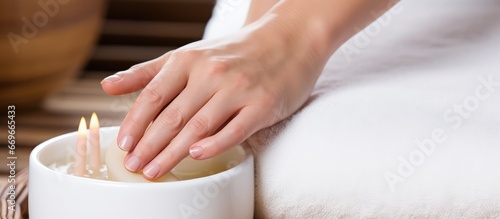 Female hands giving foot massage in spa salon seen up close
