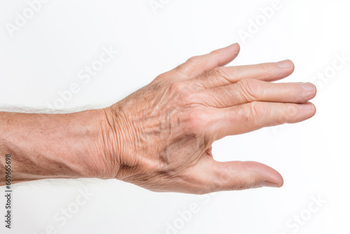 Wrinkled hands and inflamed joints in seniors highlight the need for gentle care. Isolated on white background photo