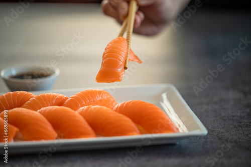 Fresh Sushi Roll with salmon.Japanese food. Copyspace black background.
