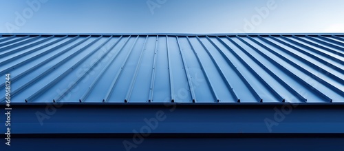 Metal sheet on the roof of a warehouse with architectural detail photo