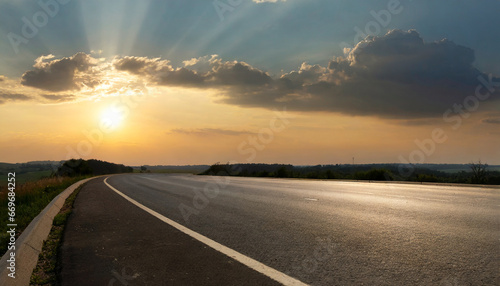 empty asphalt road and beautiful sky at sunset panoramic view high quality photo