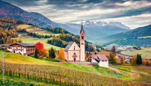 astonishing autumn view of san genesio and santa barbara churches gloomy morning scene of tolpei village province of bolzano south tyrol italy beauty of countryside concept background