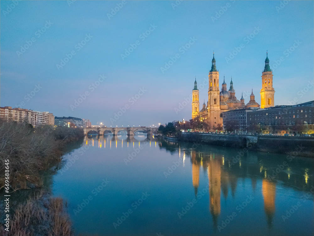 Sunset of The Basilica of Our Lady of the Pillar seen from the Ebro river, Zaragoza, Spain