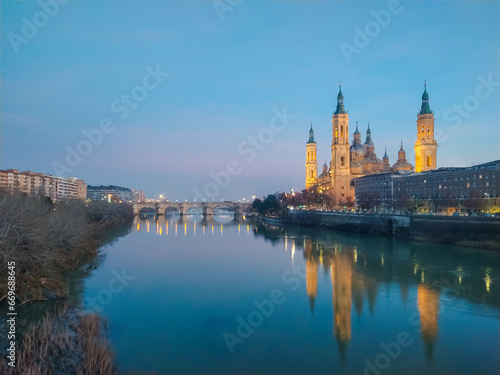 Sunset of The Basilica of Our Lady of the Pillar seen from the Ebro river, Zaragoza, Spain