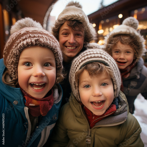 Joyful children in winter hats take selfies outdoors