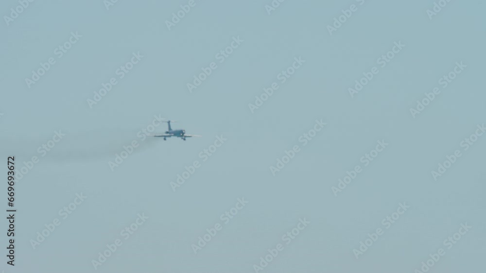 Long shot of jet plane approaching for a landing. Airliner in the blue sky. Tourism and travel concept Long shot of jet plane approaching for a landing. Airliner in the blue sky. Tourism and travel concept