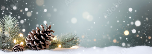 christmas background with pine cones and snow sparkling lights. photo