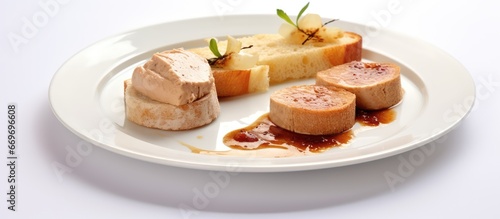 Buttered toast foie gras and radices on a white plate photo
