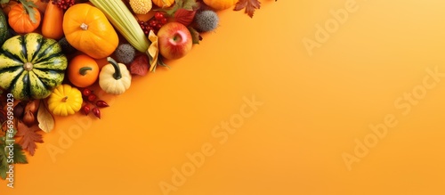 Creative autumn harvest concept with nature background Healthy food flat lay on orange background