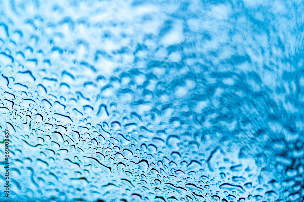 Close Up of Rainy Window with Water Droplets. A close up of a window with drops of water on it Close Up of Rainy Window with Water Droplets. A close up of a window with drops of water on it
