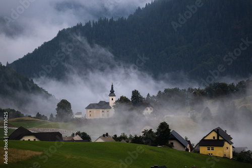 Town Sorica in beautiful Miisty Clouds - Slovenian  Alps  photo