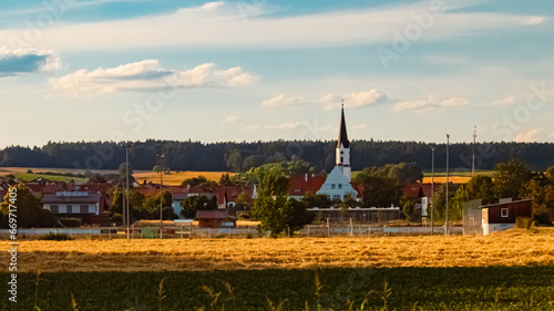 Agricultural summer view with a church near Weng, Woerth an der Isar, Landshut, Bavaria, Germany