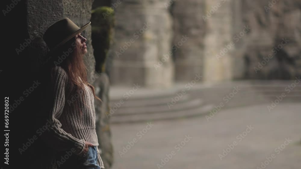 A beautiful, stylish woman awaits a meeting, she waits, looking around and exploring the area. A cowgirl in a tourist spot. Romantic atmosphere, western mood.A silhouette and figure. Cinematic A beautiful, stylish woman awaits a meeting, she waits, looking around and exploring the area. A cowgirl in a tourist spot. Romantic atmosphere, western mood.A silhouette and figure. Cinematic