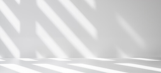 Realistic and minimalist blurred natural light windows, shadow overlay on wall paper texture, abstract background. Minimal abstract light white background for product presentation.