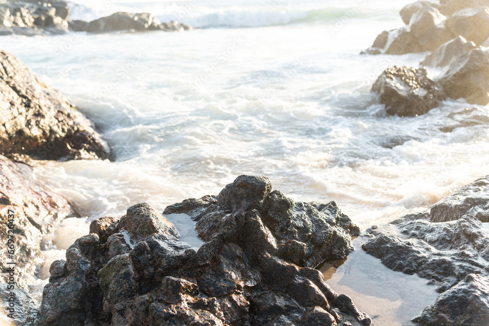 Sea waves breaking on the beach rocks. Sea waves breaking on the beach rocks.