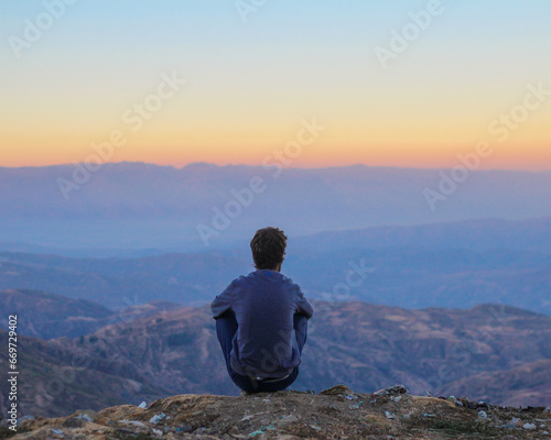 homem contemplando por do sol na cordilheira dos andes, bolivia  photo