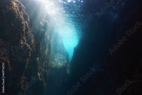 Rocky underwater landscape in the Mediterranean sea, narrow passage with sunlight through water surface, natural scene, Spain, Costa Brava, Catalonia