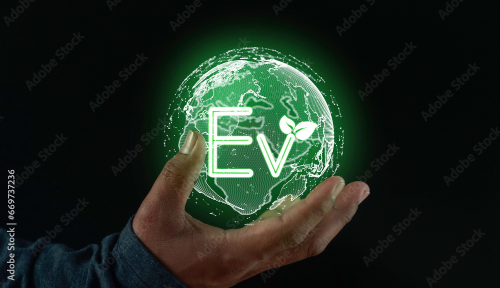 Businessman show Ev icon Light bulb, EV concept, Hand of human holding global with EV icons, Green sustainable energy produced from renewable resources. Businessman show Ev icon Light bulb, EV concept, Hand of human holding global with EV icons, Green sustainable energy produced from renewable resources.