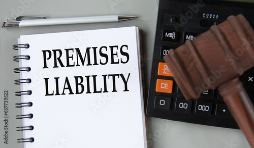Konstfotografi PREMISES LIABILITY - words in a white notebook on the background of a calculator
