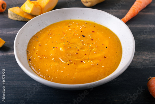 Pumpkin and carrot cream soup. Autumn dish suitable for lunch and dinner.