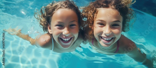 Wallpaper Mural Joyful girls in swimming pool Torontodigital.ca