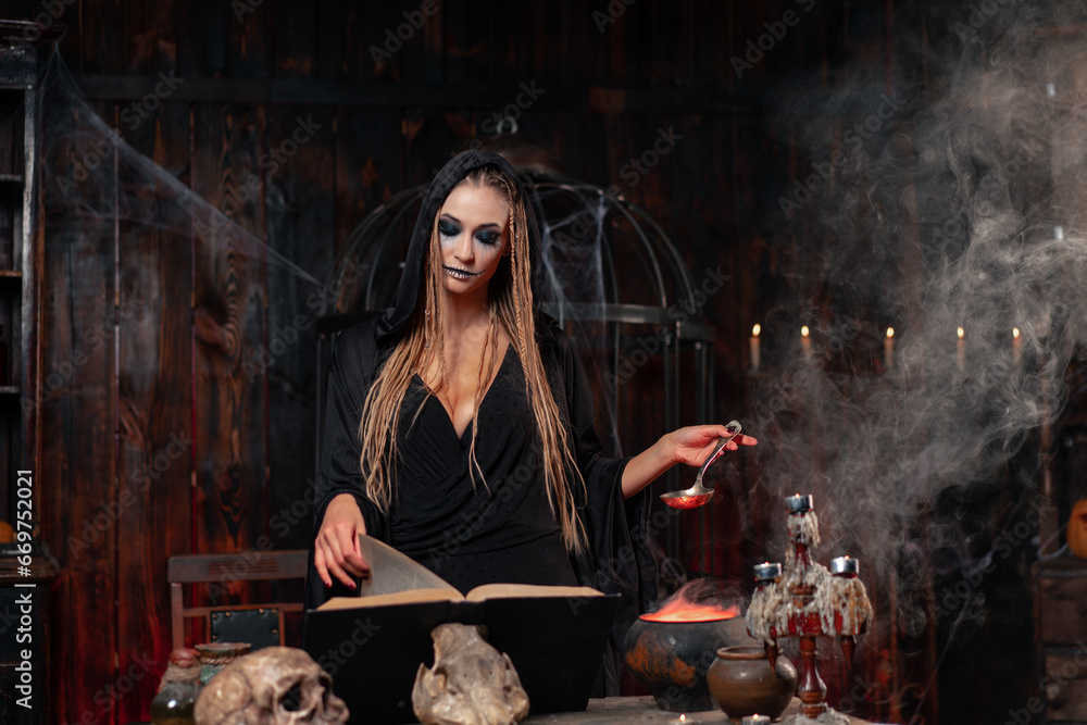 Halloween, witch use magic book and cauldron prepare poison or love ...