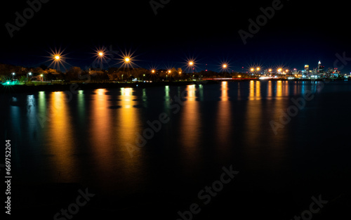 Streetlamps Reflecting in Lake Erie with Cleveland in the Distance