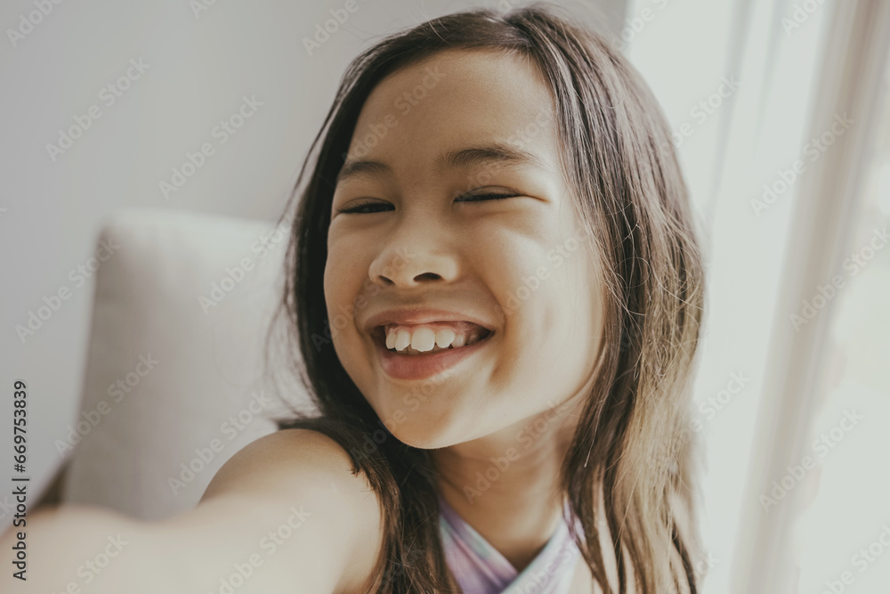 Young mixed Asian happy preteen girl selfie, healthy, cheerful and confident child, positive kid wellness concept Young mixed Asian happy preteen girl selfie, healthy, cheerful and confident child, positive kid wellness concept