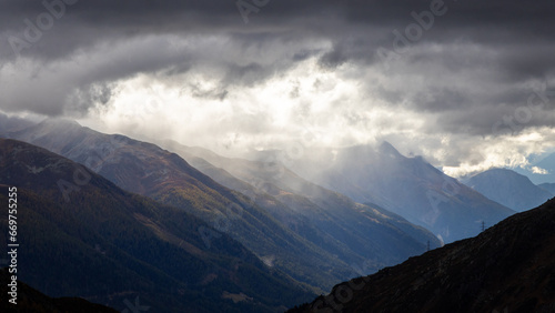 Konstfotografi View from the Rhone glacier over the Rhone vally and the village of Gletsch in the Alpes of Switzerland