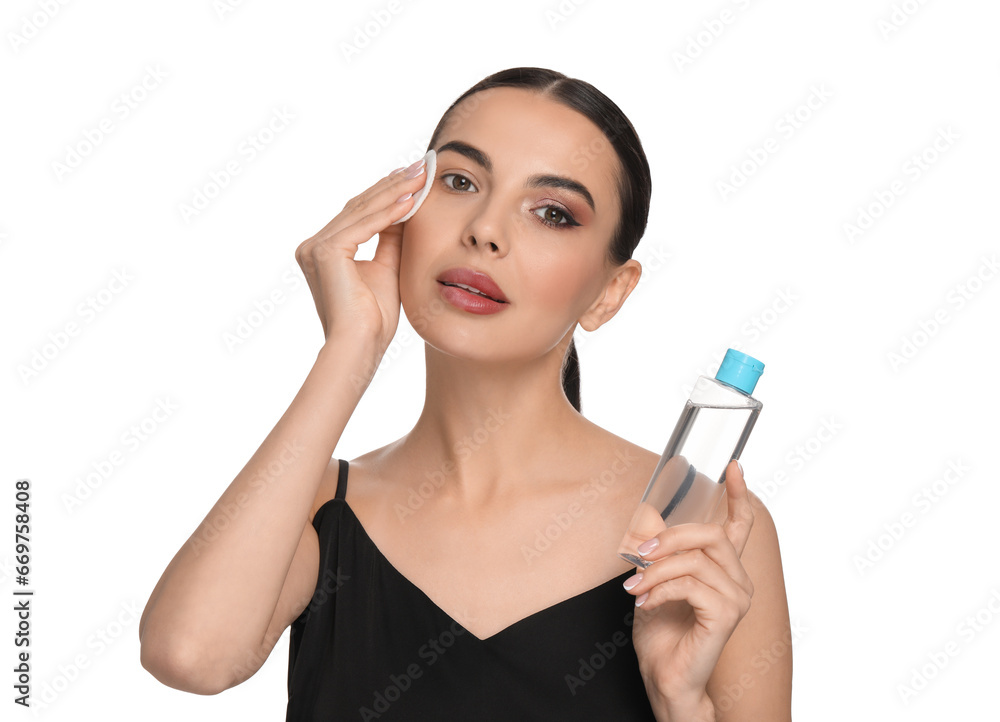 Beautiful woman removing makeup with cotton pad on white background Beautiful woman removing makeup with cotton pad on white background