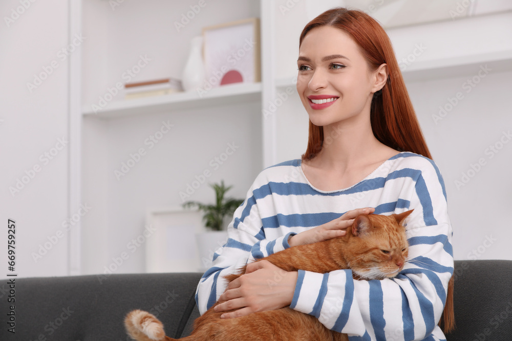Happy woman with her cute cat at home. Space for text Happy woman with her cute cat at home. Space for text