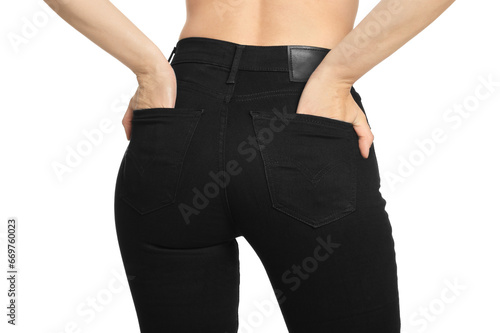 Woman wearing stylish black jeans on white background, closeup