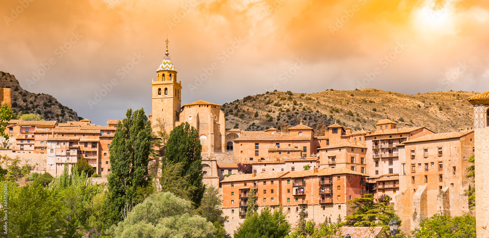 Panorama of an orange sky over historic town Albarracin, Spain