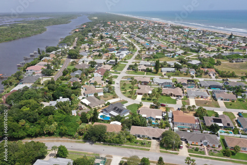 Aerial looking north over Daytona Beach, Florida residential neighborhoods, , the Intracoastal Waterway, and the Atlantic Ocean.