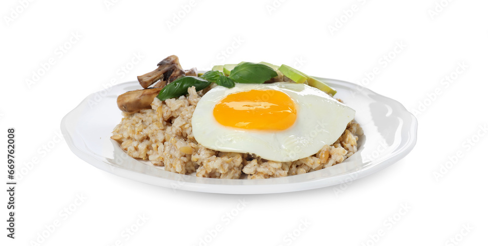 Tasty boiled oatmeal with fried egg, avocado and mushrooms isolated on white Tasty boiled oatmeal with fried egg, avocado and mushrooms isolated on white