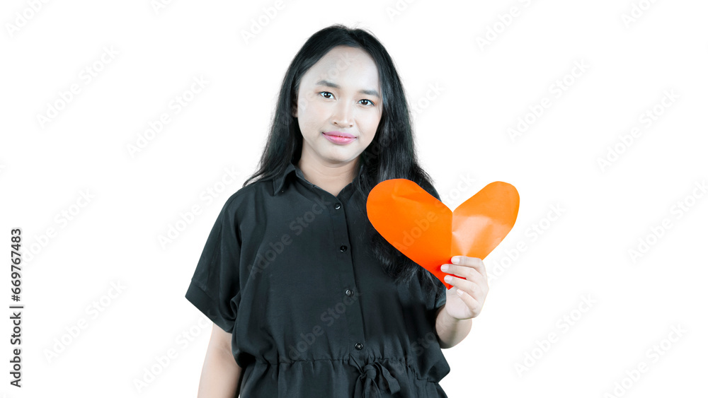 Lonely sad girl with heart paper isolated on white background Lonely sad girl with heart paper isolated on white background