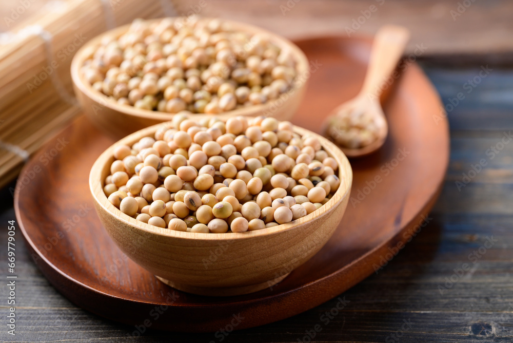 Soybean seed in bowl on wooden background, Healthy ingredients in vegan food Soybean seed in bowl on wooden background, Healthy ingredients in vegan food
