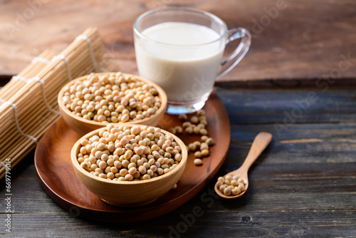Soybean seed and soy milk on wooden background, Healthy drink