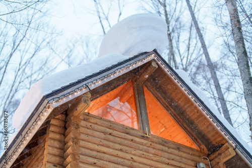 Beautiful Cottage in the forest at Furano Ningle Terrace with Snow in winter season. landmark and popular for attractions in Hokkaido, Japan. Travel and Vacation concept